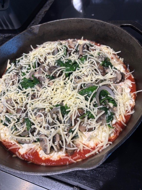 Cast iron is magic to make the cheesy crust perfection.